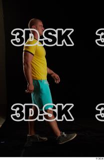 Walking reference of yellow shirt turquoise shorts brown shoes Leland…